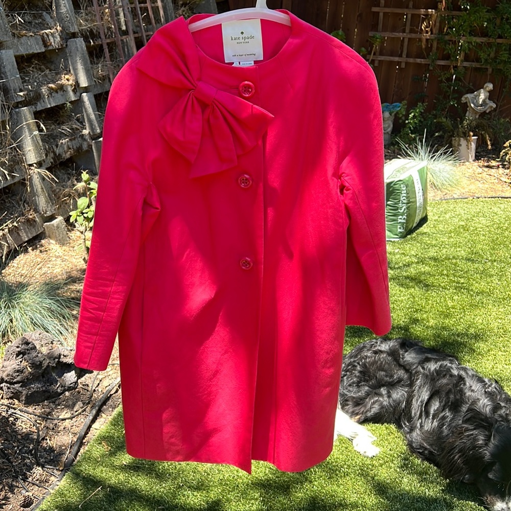 Pink classic Kate Spade jacket with Bow.  Perfect with jeans or dressed up